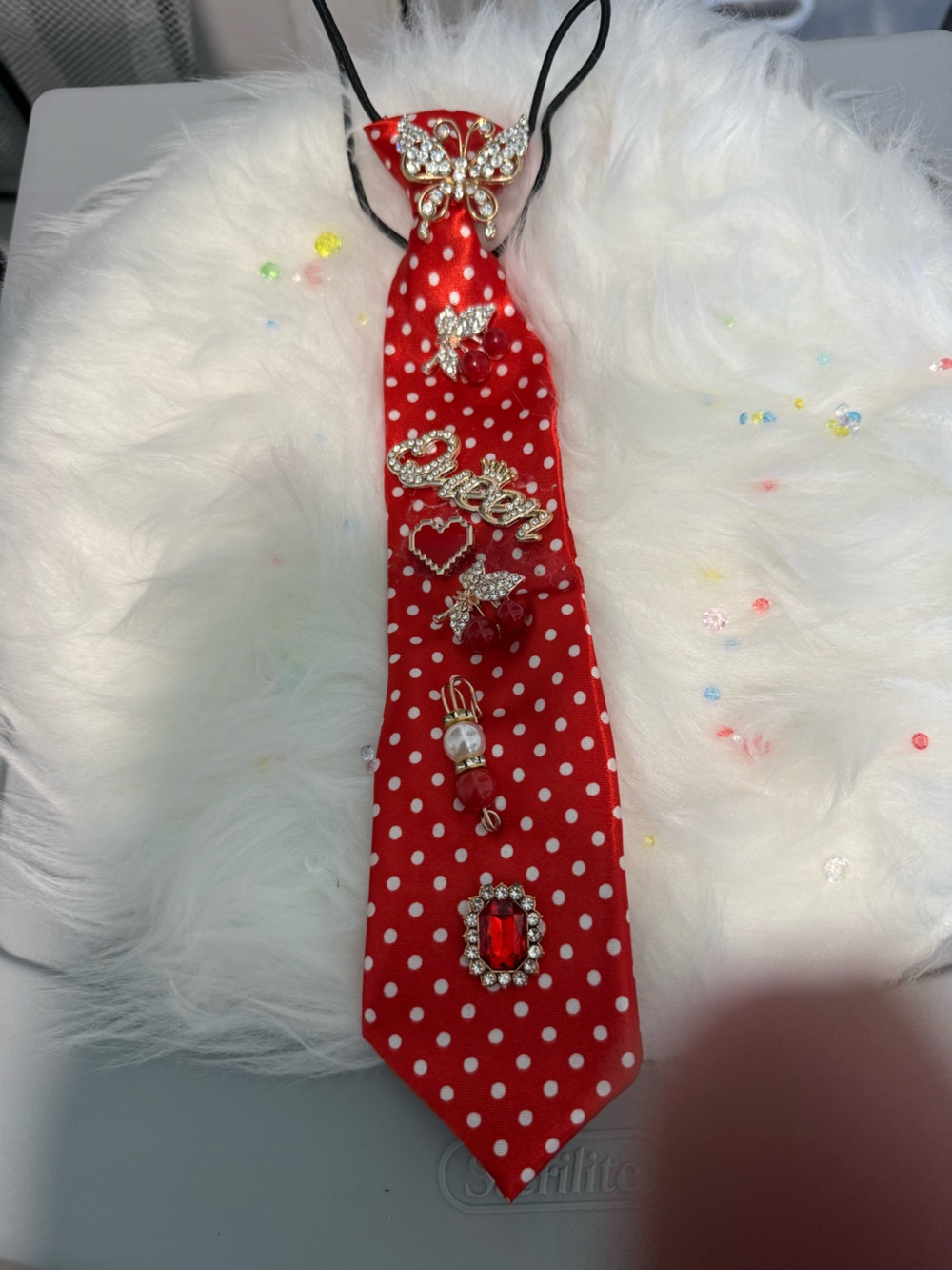 Red & White poker dot tie with gold accessories